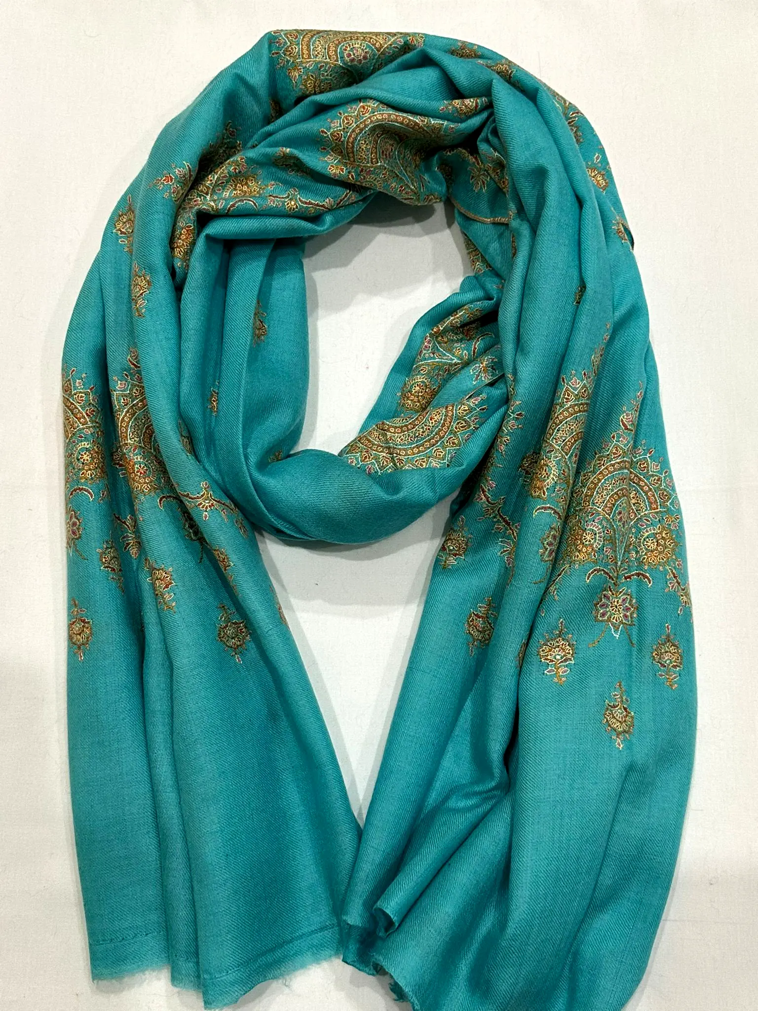 Aqua stole with gold paisley needlework.