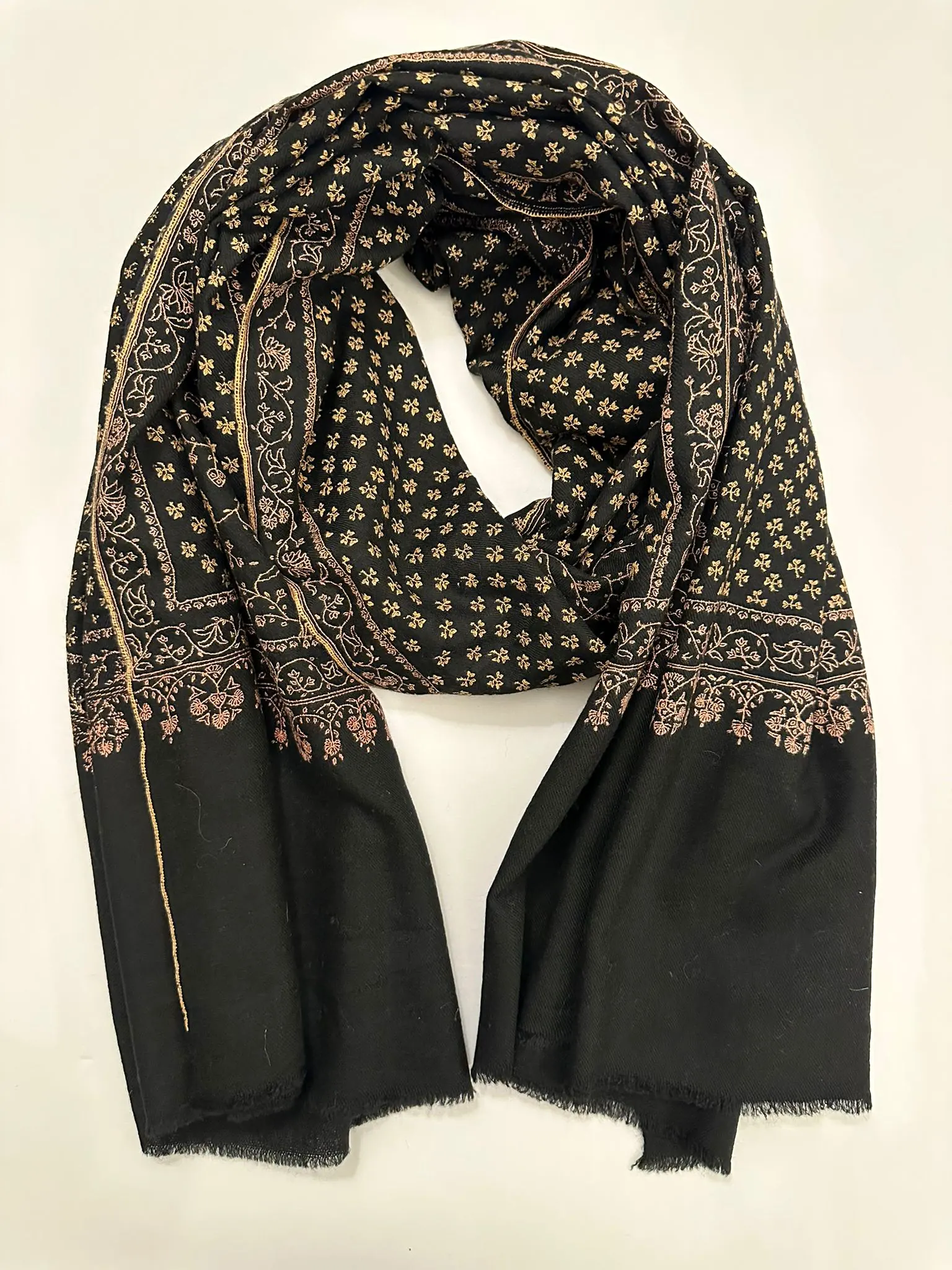 Black stole with small gold needlework motifs across the upper half.