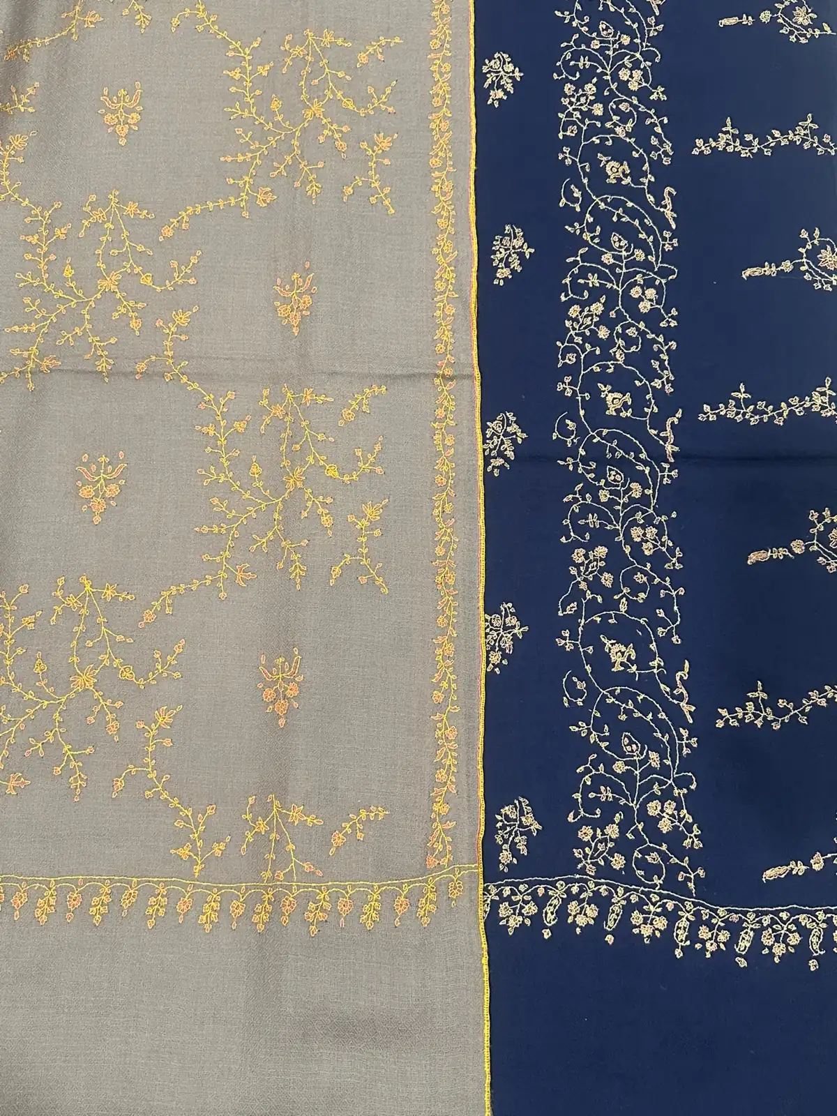 Grey and navy stoles with gold and pale sozni sprigs and borders.