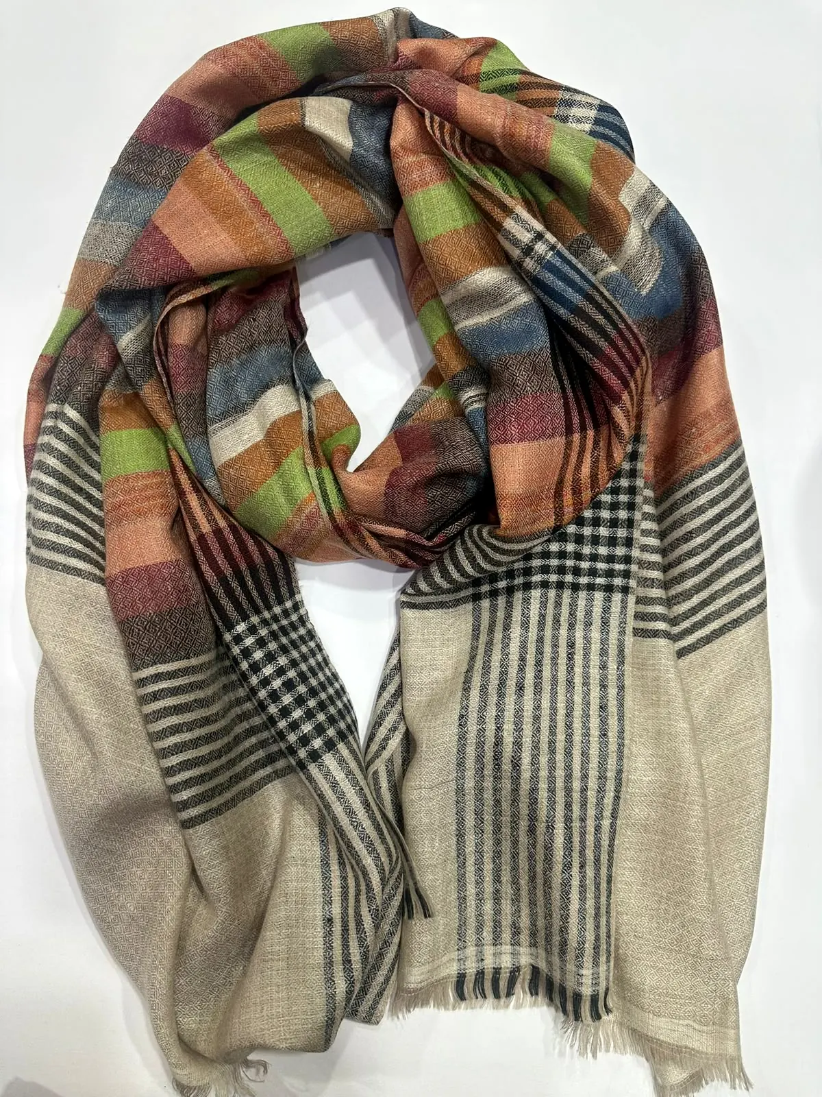 Stole in green and orange plaid blocks with black and white check ends.