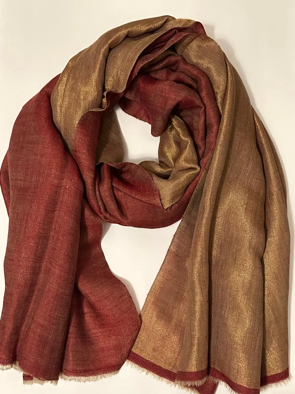 Reversible stole in maroon on one face and shimmering gold on the other.