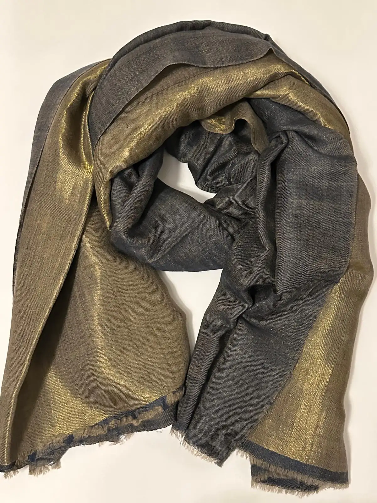 Reversible stole in slate grey on one face and shimmering gold on the other.