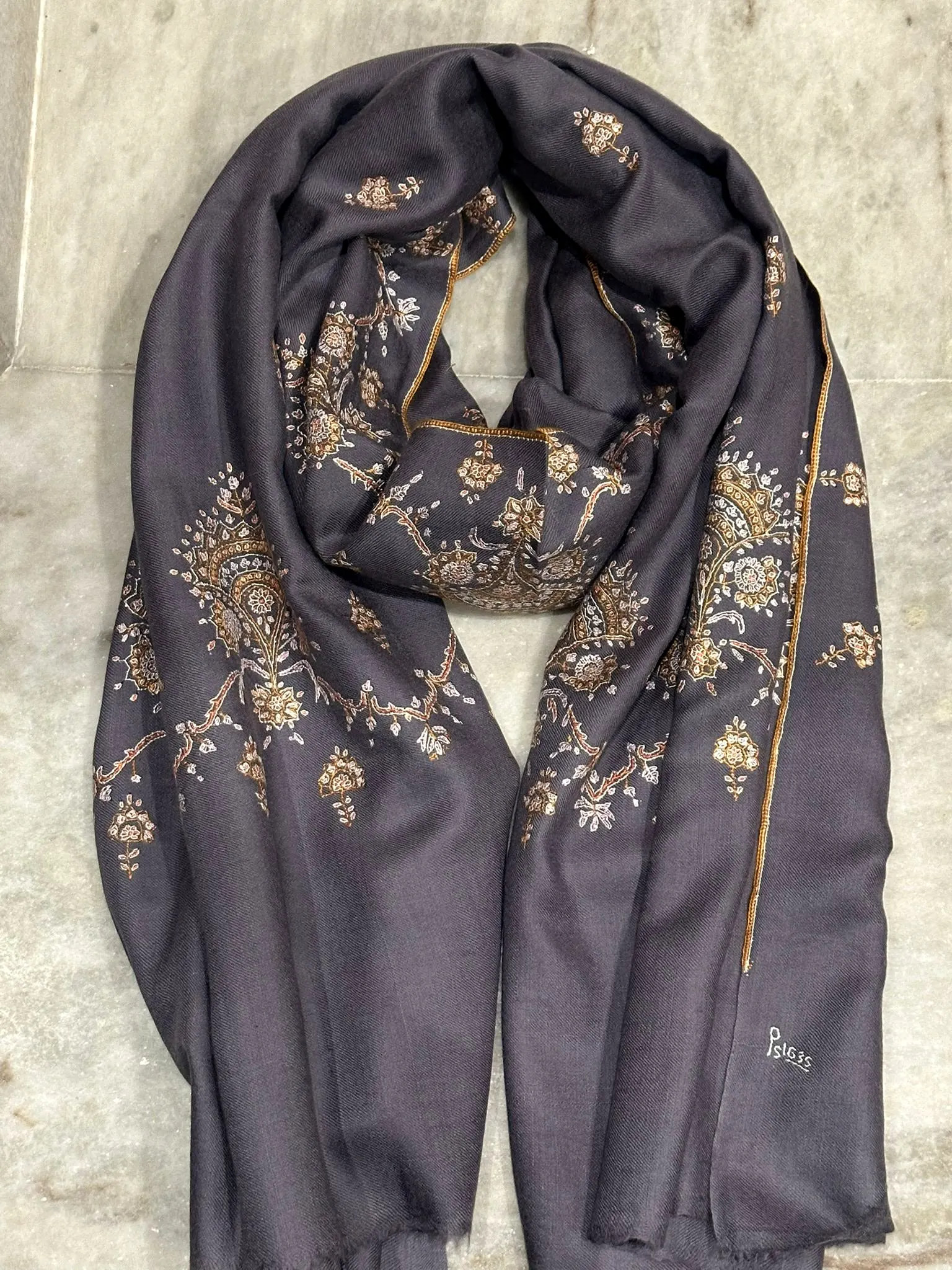 Slate grey stole with gold floral needlework.