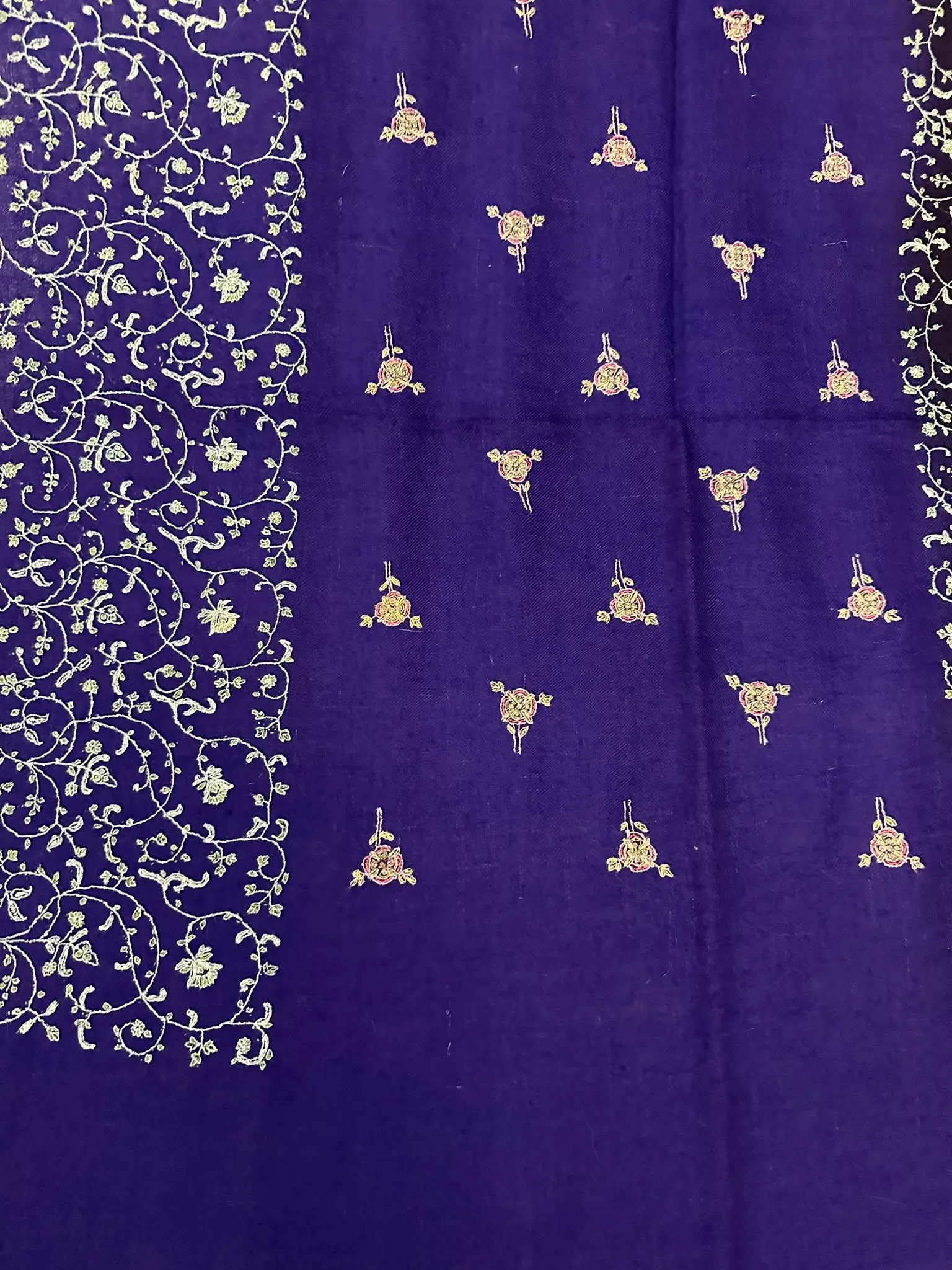 Flat view of the violet field with scattered motifs and a jaal band.